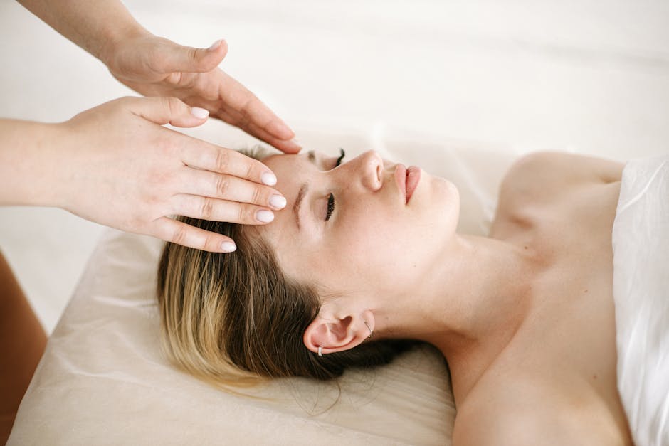 peaceful woman demonstrating eye massage technique with gentle circular motions around closed eyes