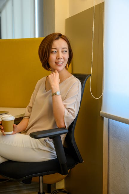 relaxed professional woman enjoying eye massage break in modern office environment